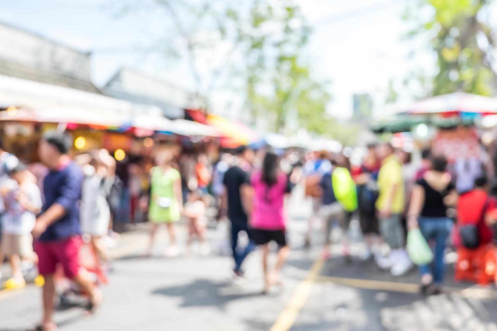 A street fair special event with people walking