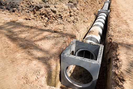 An underground installation of a sewer connection and line