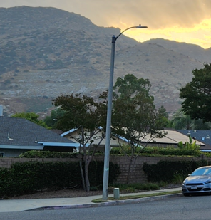 City Street Light - Residential Area with a Hill in the Background